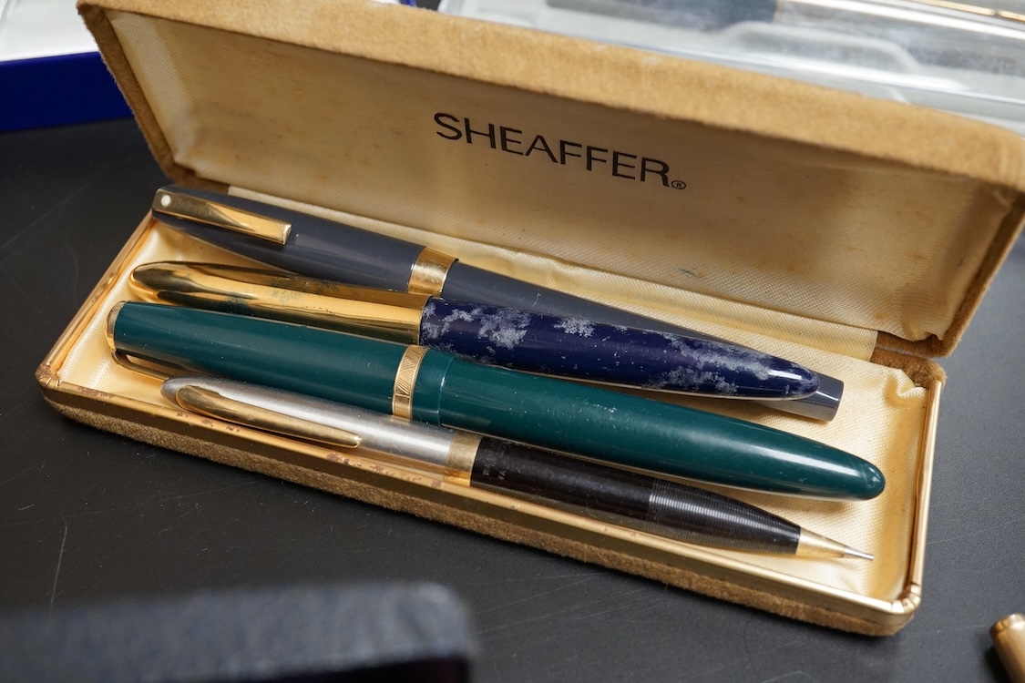Four assorted cased Waterman pens, elven other assorted pens including Scheaffer and Parker and an engine turned silver pen.